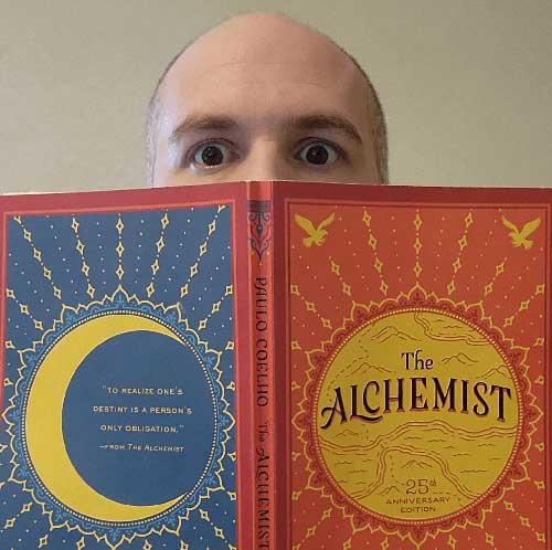 Nevin Stoltz reading The Alchemist by Paulo Coelho